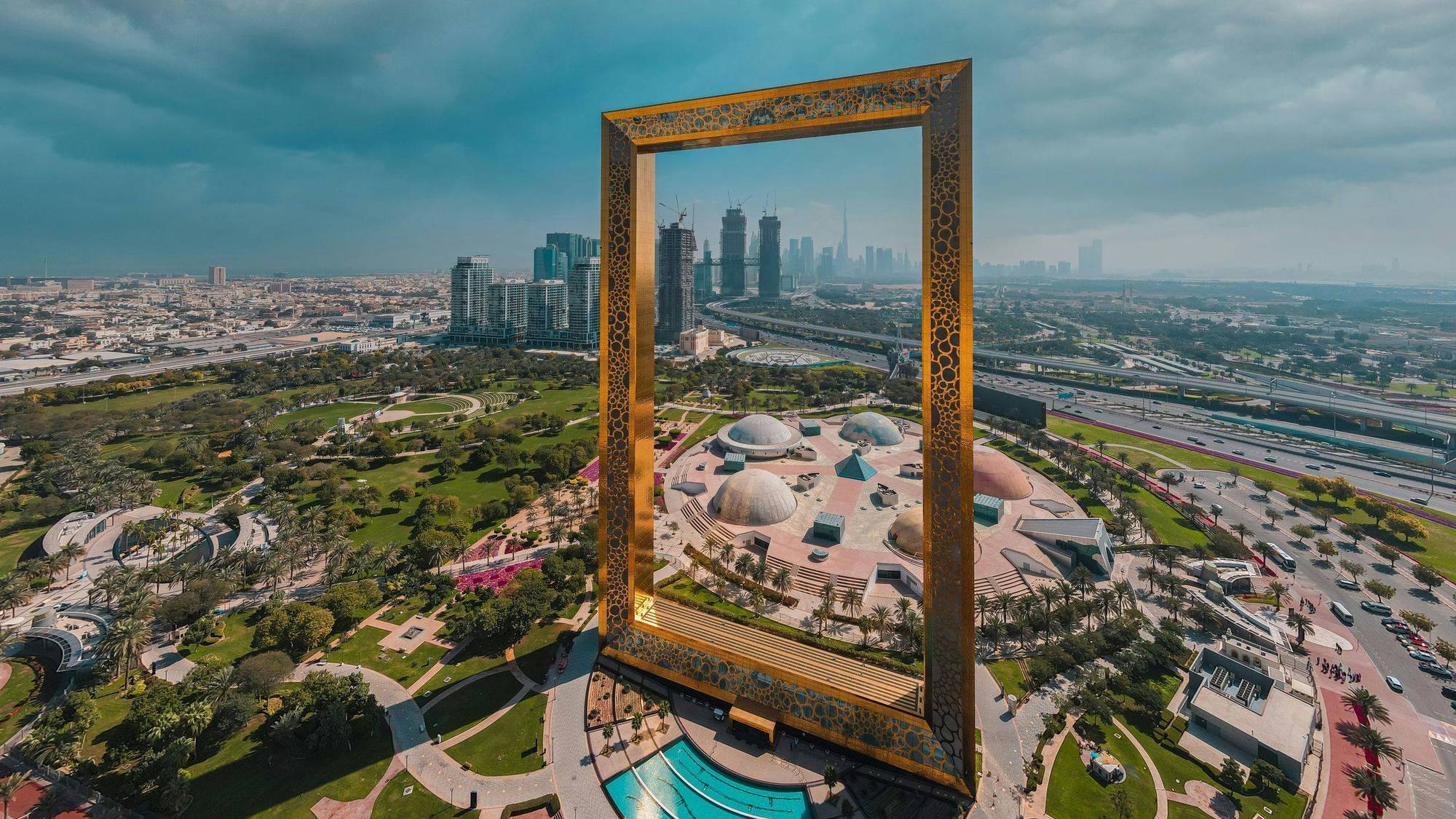 Dubai Frame in its park, with the city skyline beyond