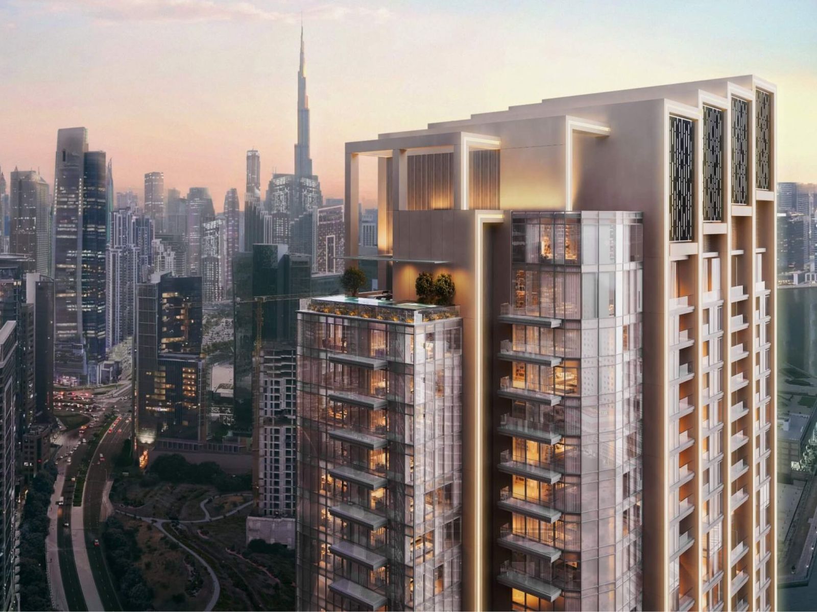 Berkeley Tower, a 60-floor Grade A office tower in Business Bay, Dubai, at sunset beside Burj Khalifa