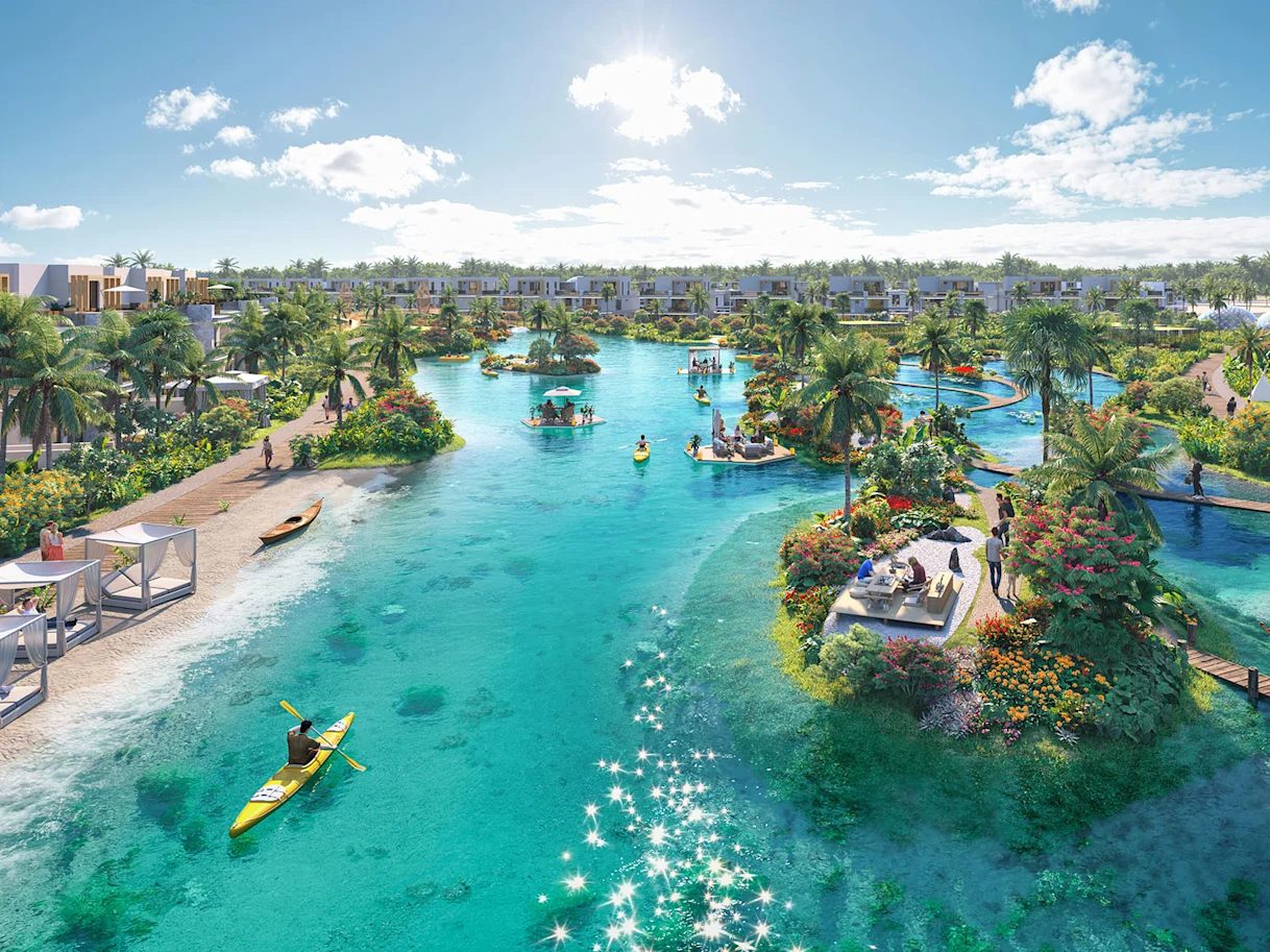 Canal with kayaks, floating decks and homes along the water at DAMAC Islands 2