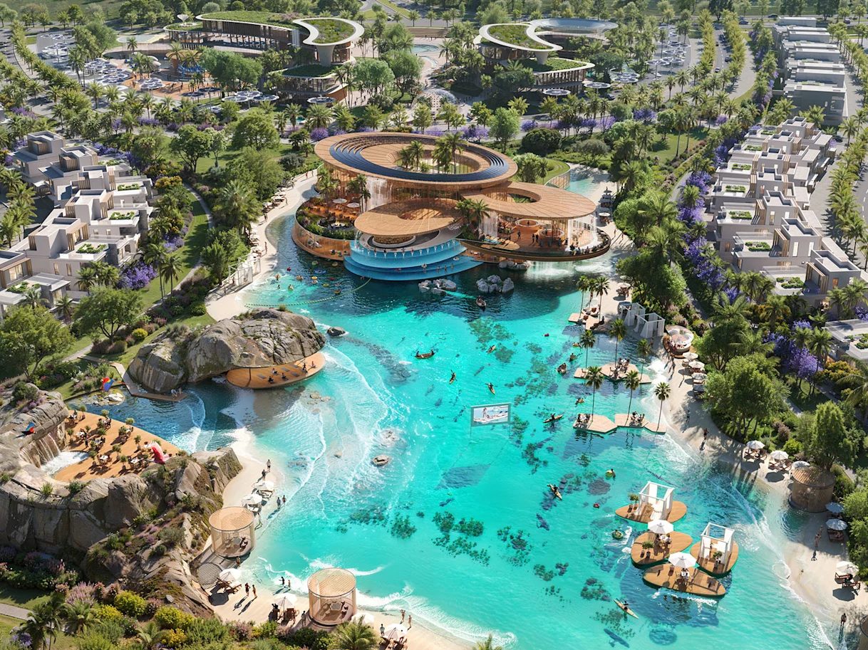 Aerial view of DAMAC Islands 2 with a central lagoon, clubhouse and surrounding homes, Dubailand