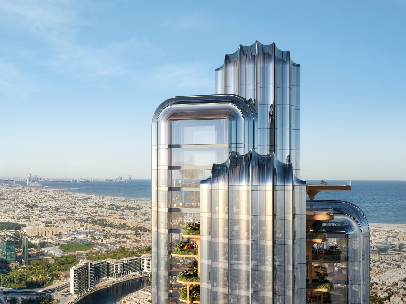 LUMENA tower crown in daylight with the Dubai coastline behind