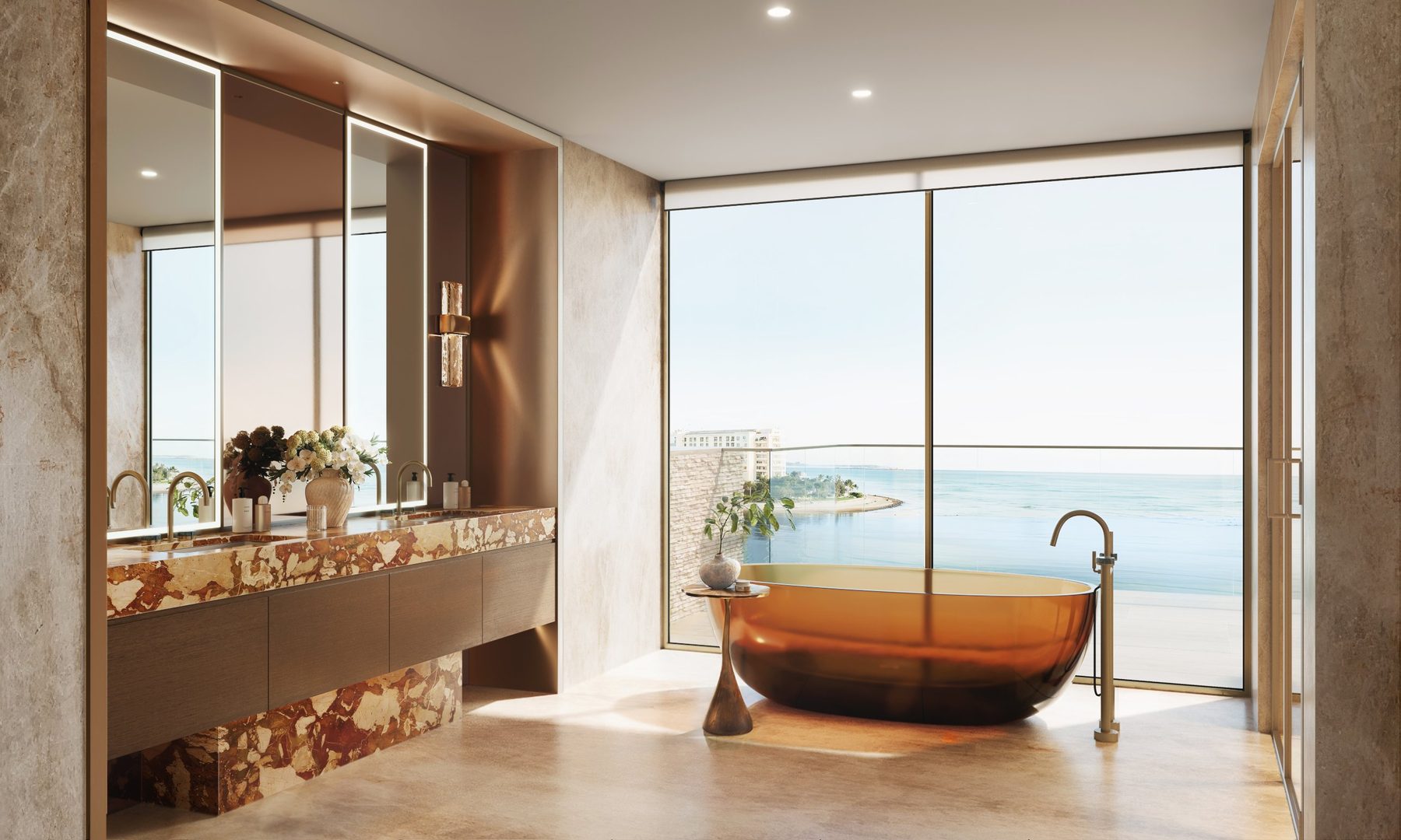 Primary bathroom with a freestanding bath and sea views
