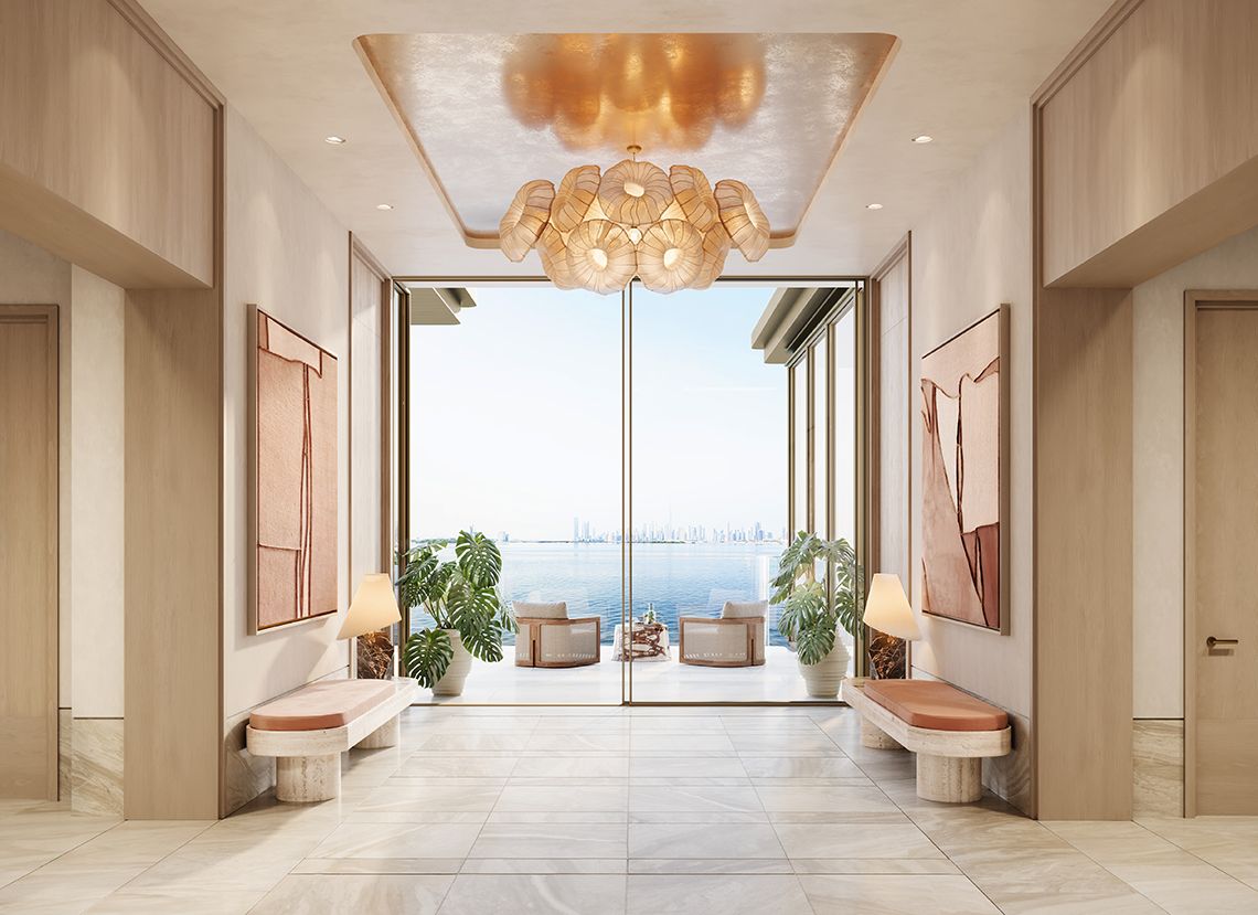 Private residence lobby opening onto a sea-facing terrace