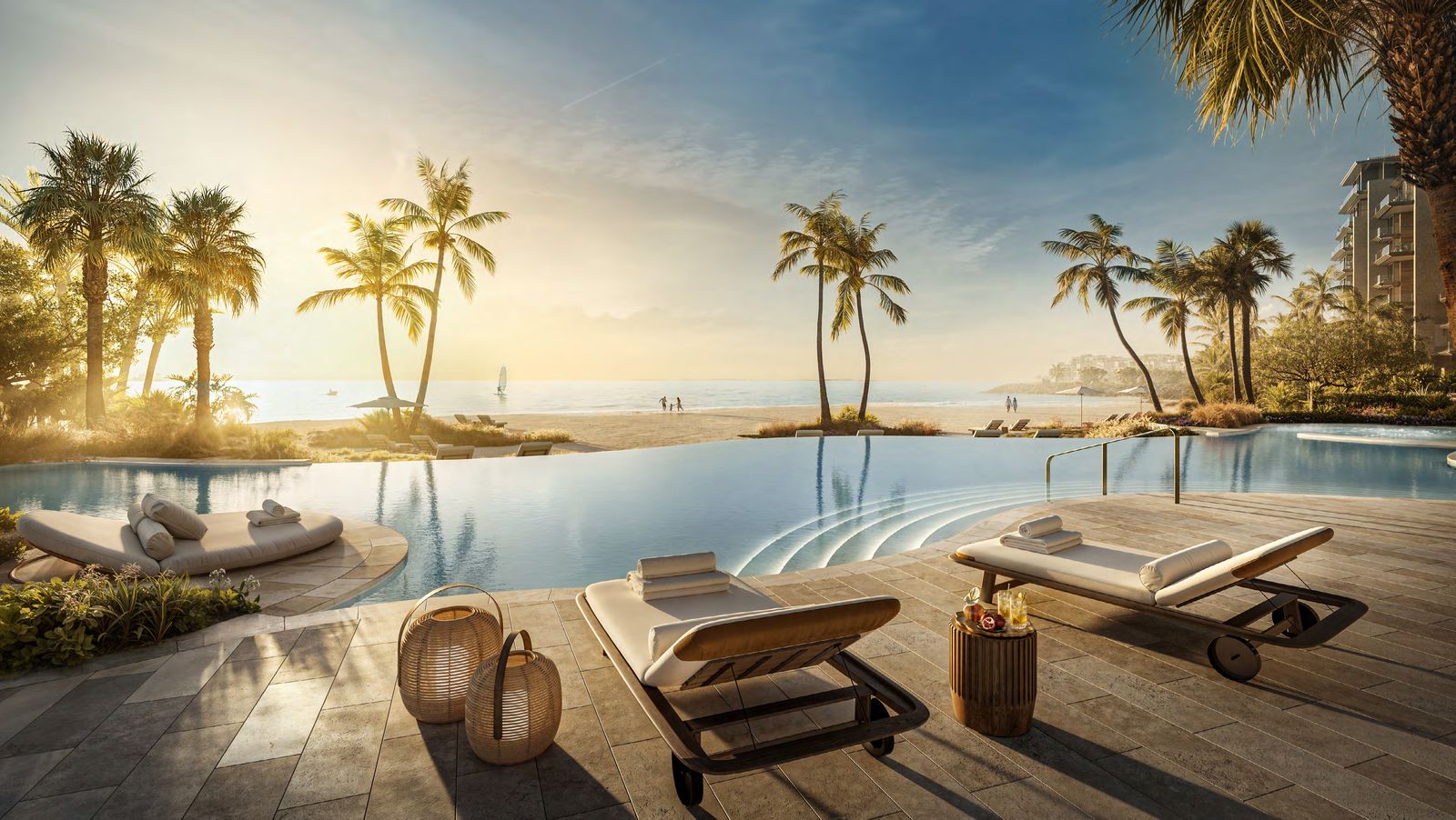 The Solaya swimming pool at sunset, with the beach beyond