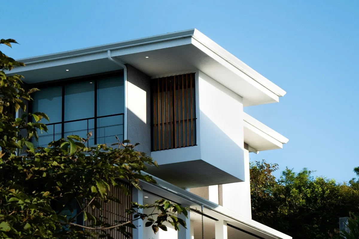 Modern townhouse with timber fins and a covered balcony