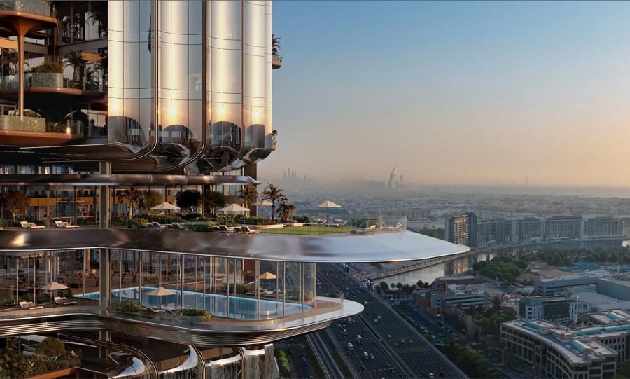 Mirrored commercial tower above the city